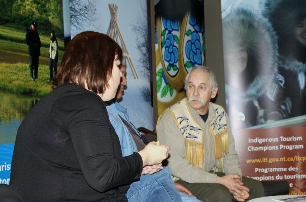 Industry, Tourism and Investment staff talking with tourism entrepreneur about GNWT tourism programming